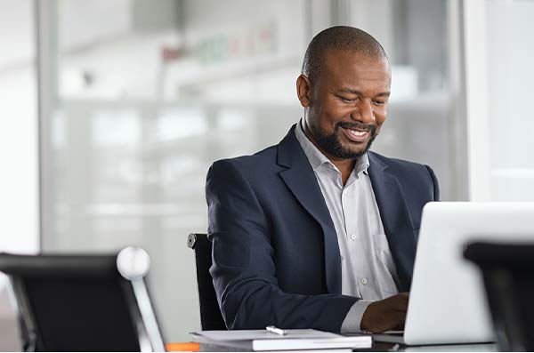 man doing home banking on laptop